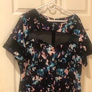 Plus party dress with pee a boo see through sweetheart neckline.